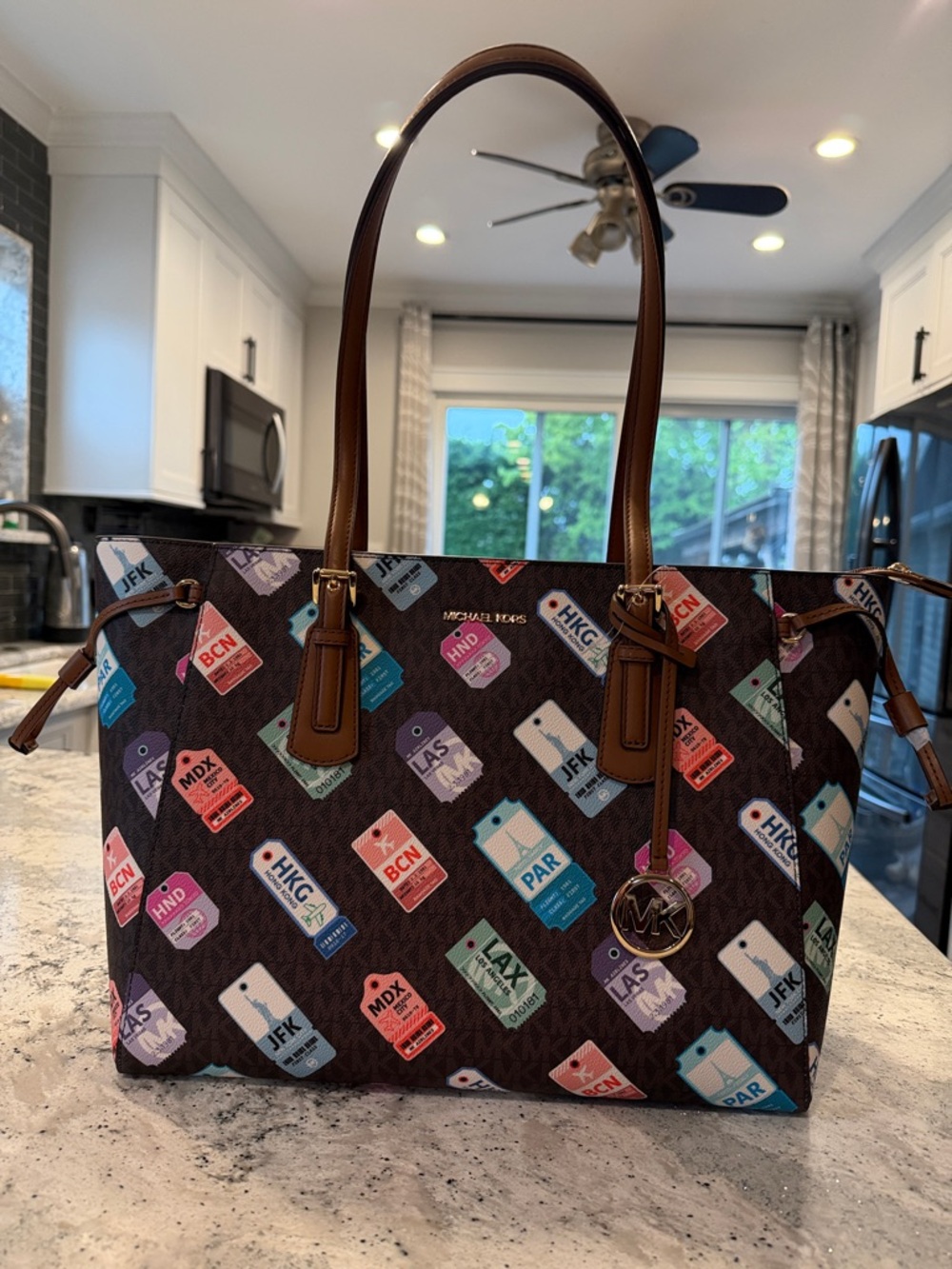 Michael Kors Brown Tote with Multicolor Travel Tag Print
